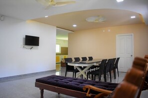 Relax in this stylish space with a dining area, comfortable sofa, and flat-screen TV.