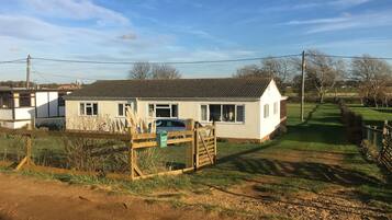 Welcome to a charming single-story home with a cozy porch and a beautifully maintained yard.