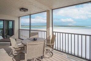 Outdoor dining - Corner Unit, Gorgeous 2B/2B Beachfront Condo at Carlos Pointe Beach Club! Heated Pool! (Fort Myers Beach)