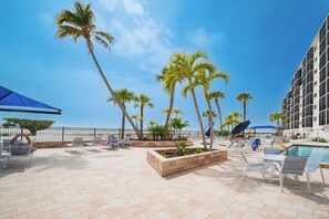 Outdoor dining - Corner Unit, Gorgeous 2B/2B Beachfront Condo at Carlos Pointe Beach Club! Heated Pool! (Fort Myers Beach)