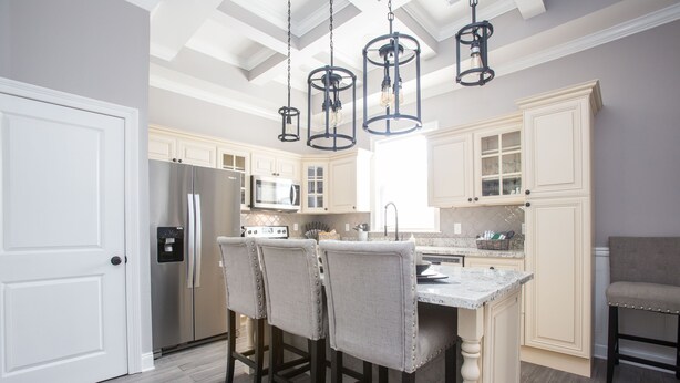 A kitchen with white cabinets, a marble island, and hanging pendant lights. - Beautiful City View GEM of NOLA, Vacation Luxury! (New Orleans)