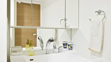 Bathtub, hair dryer, towels, soap