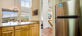 Home with hot tub, gas fireplace, and garage