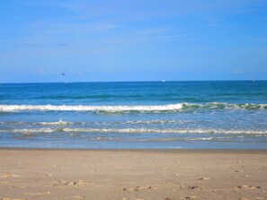 On the beach, sun-loungers