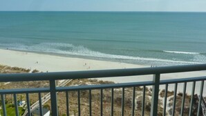 A beach with a clear view of the ocean and a sandy shore. - Luxury oceanfront condo w/ Breathtaking views. Lazy River, pools, hot tubs. (North Myrtle Beach)