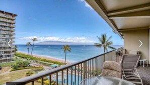 A balcony with a view of the beach and ocean. - AMAZING VIEW!  1 Back from Oceanfront 1bed/2 bath (Lahaina)