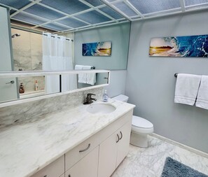 Combined shower/bathtub, hair dryer, towels, soap