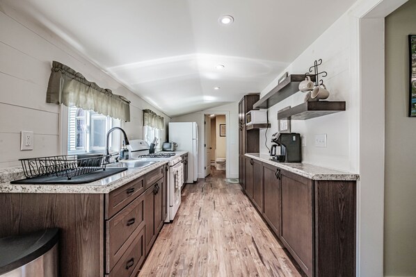 Fridge, microwave, oven, stovetop - Cheerful Single Level Home w/ Shared Beach on Sebago Lake! (Sebago)