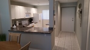 Microwave, dishwasher, coffee/tea maker, cookware/dishes/utensils