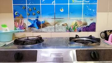 Fridge, stovetop, electric kettle, cookware/dishes/utensils