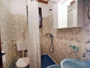 A bathroom with a toilet, a shower, and a sink. - Apartment Zdenko by Interhome (Ugljan/Kali)