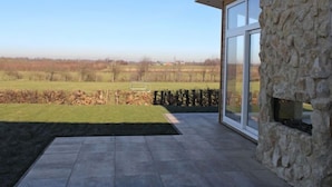 A modern building with a stone facade and large glass windows. - Green Resort Mooi Bemelen by Interhome (Bemelen)