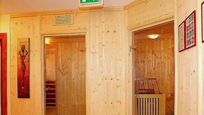A wooden interior with a staircase, a door with a sign, and a framed picture on the wall. - Schwendau by Interhome (Mayrhofen)