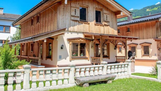 A traditional wooden house with a balcony and a stone fence. - Schwendau by Interhome (Mayrhofen)