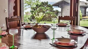 A dining table set for four with a view of mountains and a lake. - Duck House by Interhome (Montreux)