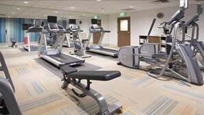 A gym with treadmills, elliptical machines, and weight benches. - Holiday Inn Express & Suites Phoenix North - Happy Valley by IHG (Phoenix)