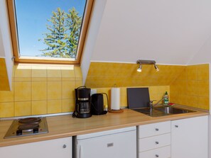 Fridge, microwave, cookware/dishes/utensils, dining tables