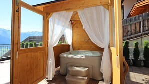 A wooden cabin with a hot tub and a small staircase. - Apartment Anita by Interhome (Zell am Ziller)