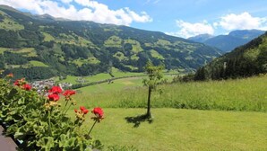 A mountainous landscape with green fields and a small village. - Annelies by Interhome (Aschau im Zillertal)