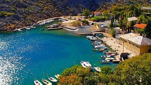 A coastal village with a marina, boats, and houses. - Apartment Sanja by Interhome (Karlobag)