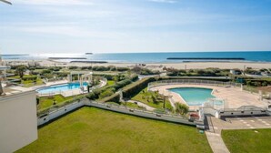 A resort with a large pool, a gazebo, and a view of the beach and ocean. - Le Sunset/Cap Sud by Interhome (Cap d'Agde)