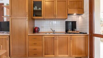 Fridge, highchair, cookware/dishes/utensils, dining tables