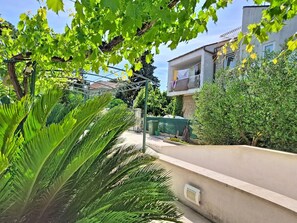 A residential area with a concrete wall, a metal fence, and a balcony with a white railing. - Bila Vila by Interhome (Zadar)