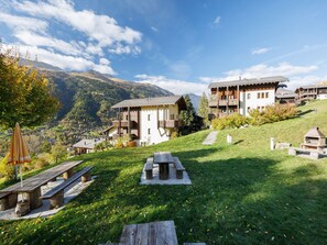 Escape to a serene mountain retreat with traditional alpine chalets and breathtaking views of the surrounding mountains.