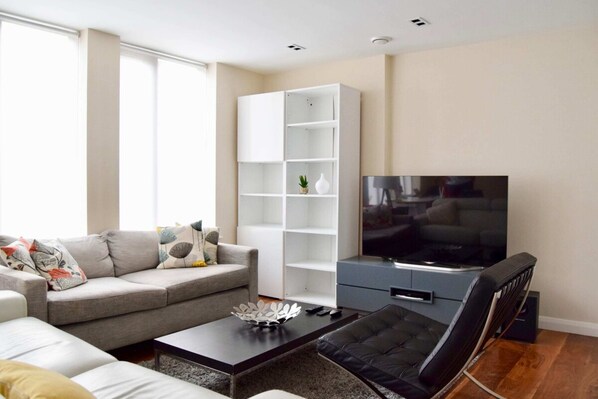 Apartment (1 Bedroom) | Living room | 20-inch TV with digital channels, Netflix, streaming services