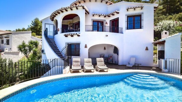 A two-story villa with a swimming pool, outdoor seating, and a staircase leading to the upper floor. - Villa Clementina by Interhome (Pego)