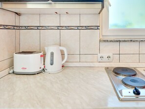 Fridge, cookware/dishes/utensils, dining tables