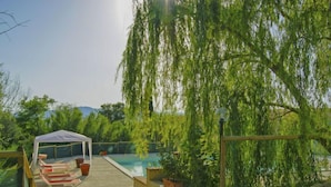 A covered outdoor area with a pool, seating, and a pergola. - Villa Sofia by Interhome (Volterra)