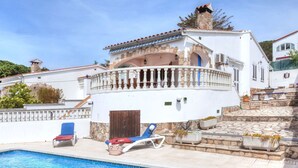 A white villa with a swimming pool, a stone staircase, and a balcony with a white balustrade. - Afrodita by Interhome (L'Escala)