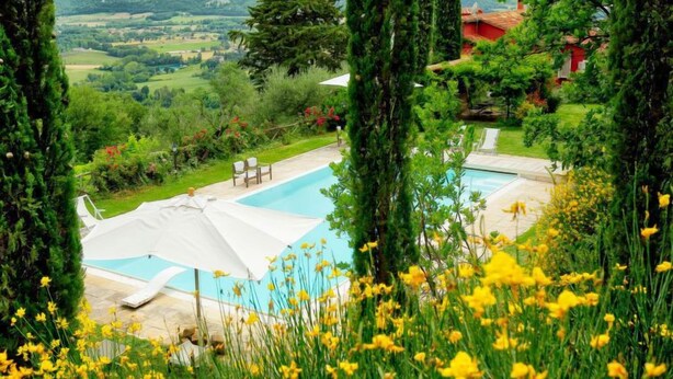 A pool area with a view of a mountainous landscape. - Paradiso by Interhome (Perugia)