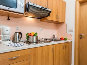 Fridge, microwave, cookware/dishes/utensils