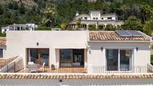A two-story building with a balcony, large windows, and a solar panel on the roof. - Centauro by Interhome (Jávea)