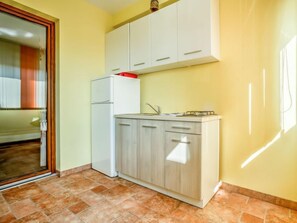 Fridge, microwave, cookware/dishes/utensils