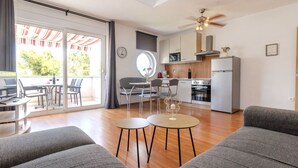 A modern apartment with a dining area, kitchen, and a balcony with a view. - Apartment Anđa by Interhome (Trogir/Slatine)