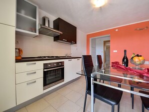 Fridge, oven, cookware/dishes/utensils