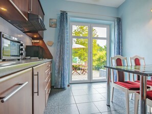 Fridge, microwave, cookware/dishes/utensils, dining tables