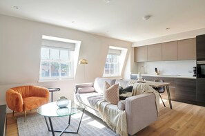 Apartment, 2 Bedrooms | Living room | Flat-screen TV
