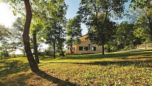 A house with a lawn and trees in the background. - Vacation home Vesna by Interhome (Buzet)