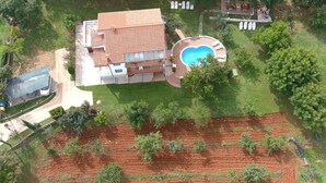 An aerial view of a house with a swimming pool, a patio, and a fenced yard. - Apartment  Ana by Interhome (Porec/Jehnici)