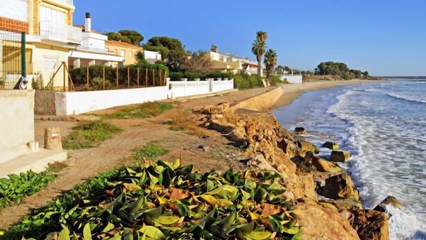 A coastal property with a paved walkway leading to a rocky beach. - Urb.Maricel by Interhome (Alcanar)