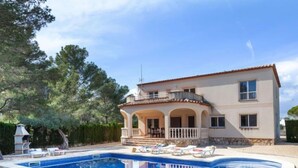 A two-story house with a swimming pool and outdoor seating. - Villa Alguer by Interhome (L'Ametlla de Mar)