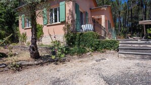 A rustic house with a stone facade, green shutters, and a stone staircase leading to a balcony. - Les Ecureuils by Interhome (Gordes)