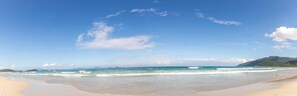 A beach with clear skies and calm waters. - Jungle Beach (Dong Ninh Hoa)