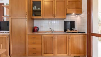 Fridge, highchair, cookware/dishes/utensils, dining tables
