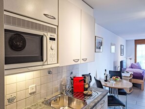 Fridge, microwave, cookware/dishes/utensils
