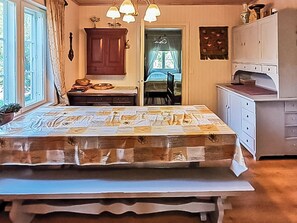 A bedroom with a bed, a dresser, a window, and a door. - Virrin tila by Interhome (Sastamala)